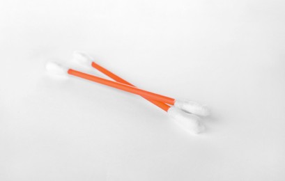 Photo of Clean cotton buds on white background. Hygienic accessory