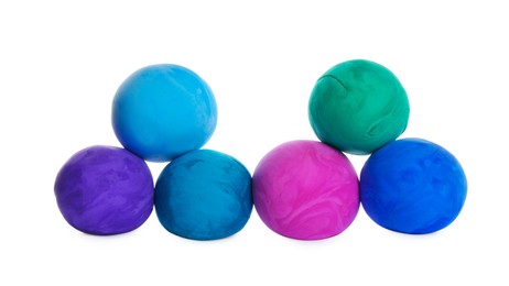 Photo of Different color play dough balls isolated on white