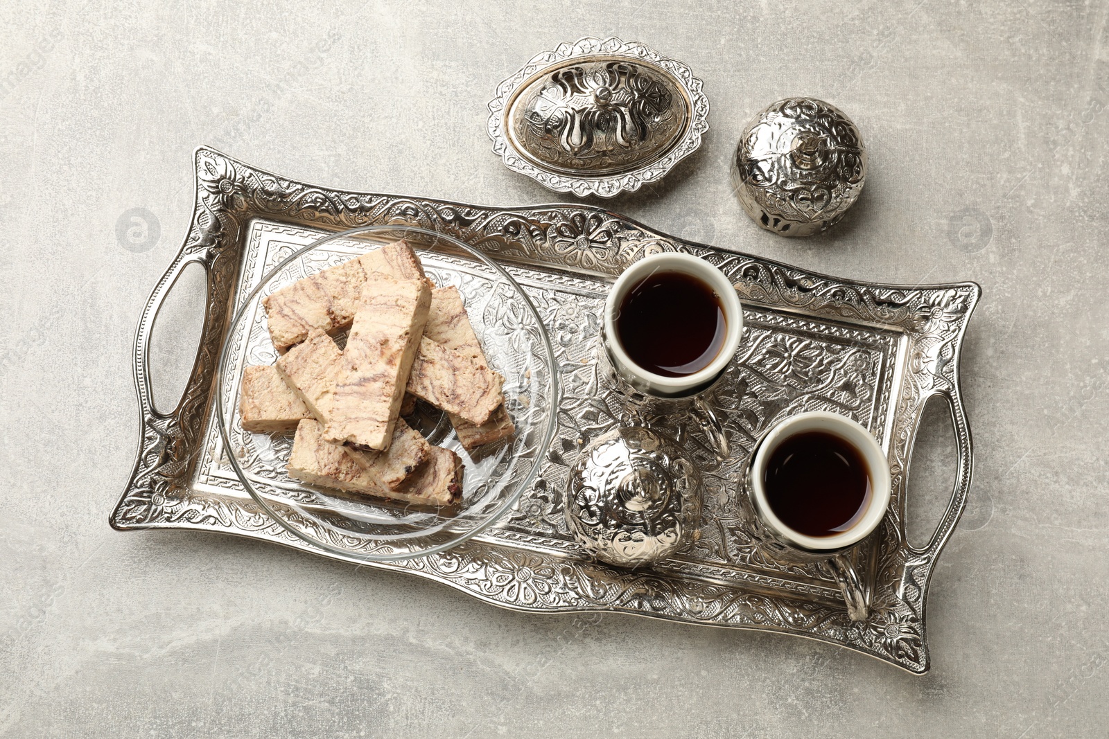 Photo of Tasty chocolate halva served on light grey table, top view