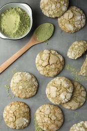 Tasty matcha cookies and powder on grey table, flat lay