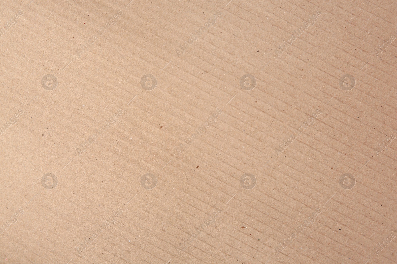 Photo of Texture of beige paper sheet as background, closeup