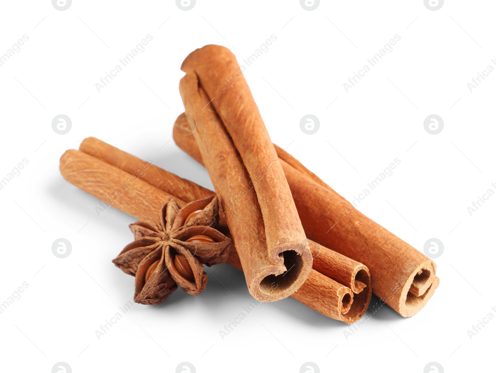 Photo of Cinnamon sticks and anise star isolated on white