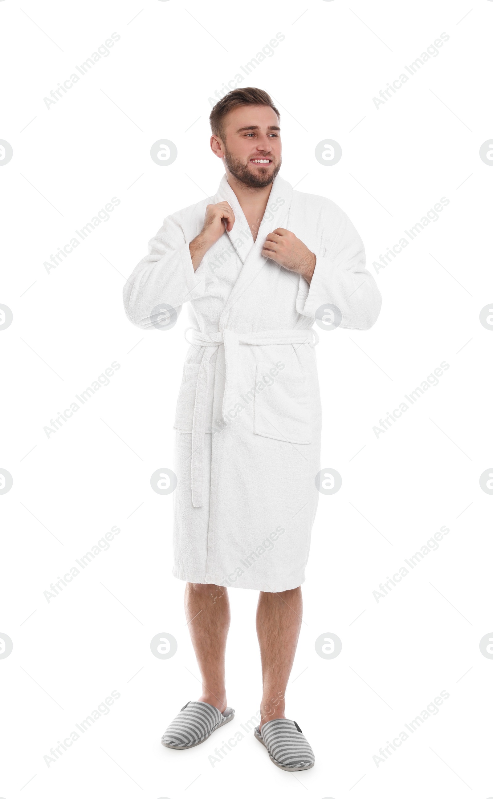 Photo of Handsome man wearing bathrobe on white background