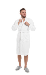 Photo of Handsome man wearing bathrobe on white background