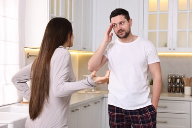 Emotional couple arguing in kitchen. Relationship problems