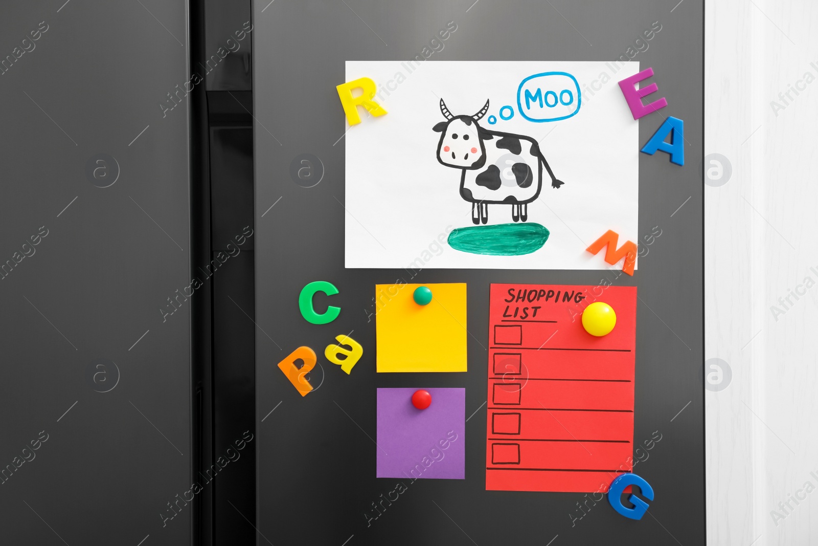 Photo of Modern refrigerator with child's drawing, notes and magnets, closeup