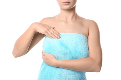 Woman checking her breast on white background, closeup