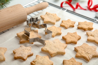 Tasty homemade Christmas cookies on baking parchment