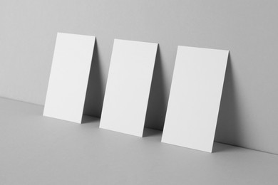 Photo of Blank business cards on light gray background. Mockup for design