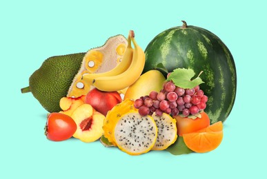 Image of Many different fresh fruits on mint color background