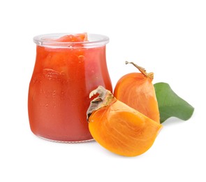 Photo of Jar of tasty persimmon jam and fresh fruits on white background