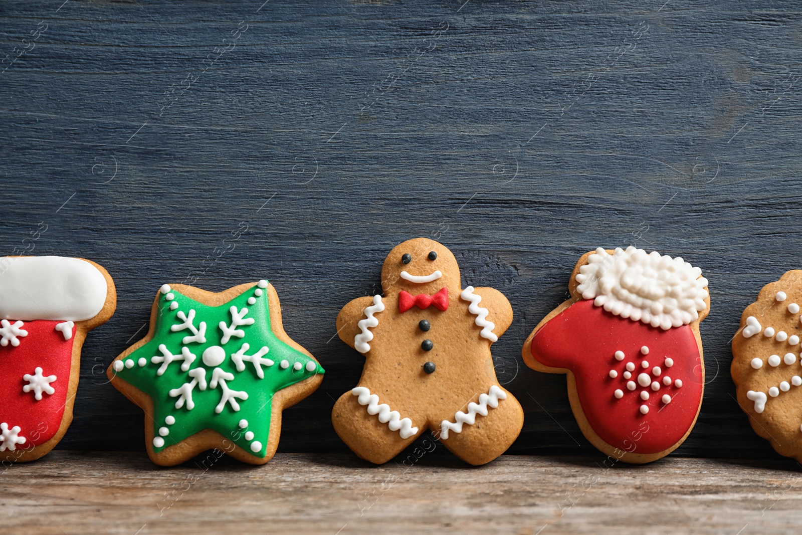 Photo of Tasty homemade Christmas cookies on table, space for text