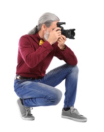 Male photographer with professional camera on white background