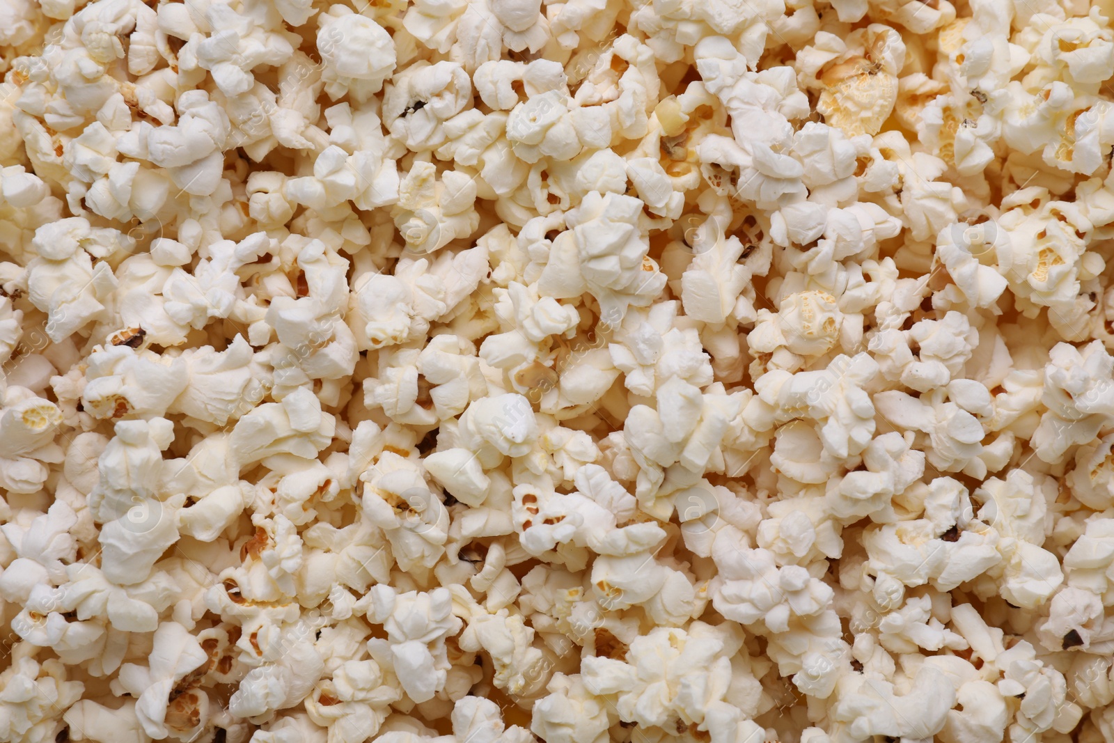 Photo of Tasty pop corn as background, top view