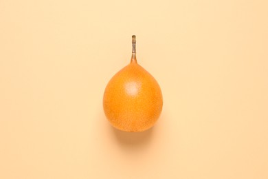 Photo of Delicious ripe granadilla on beige background. top view