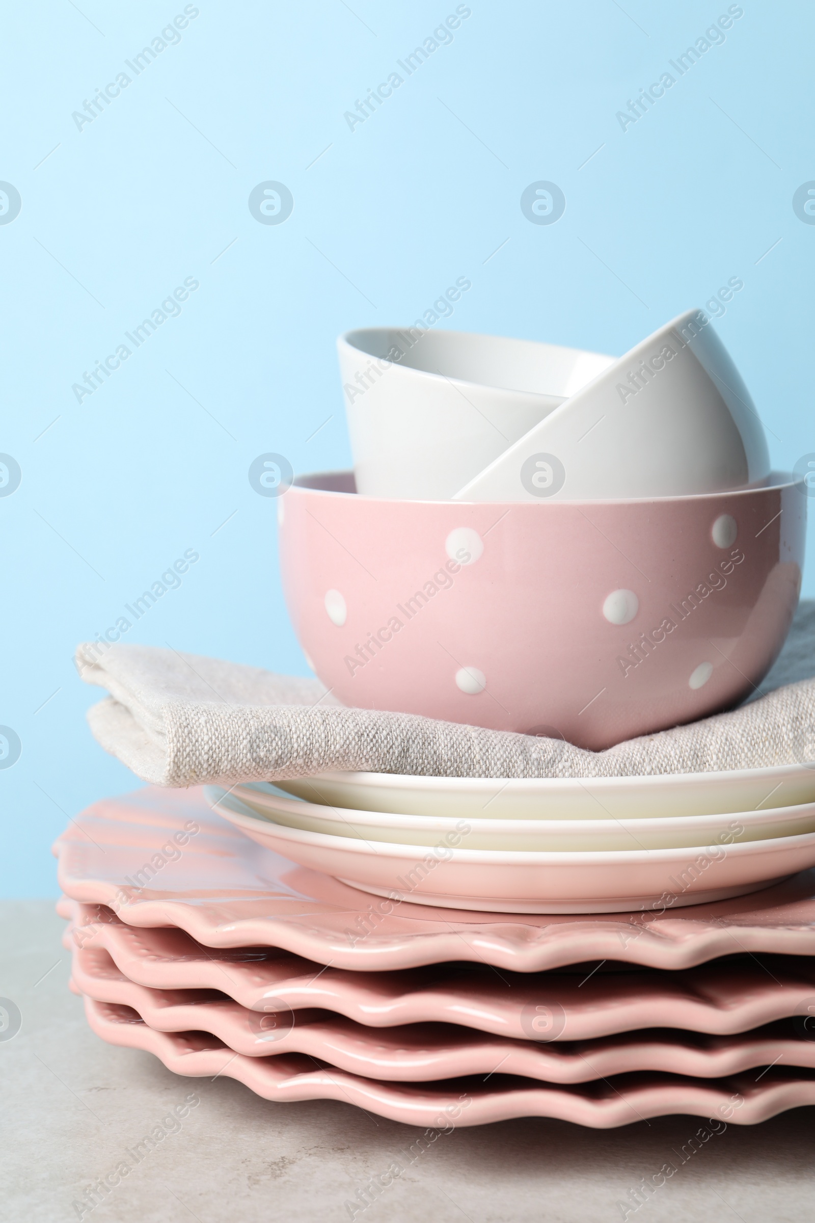 Photo of Beautiful ceramic dishware on light grey table