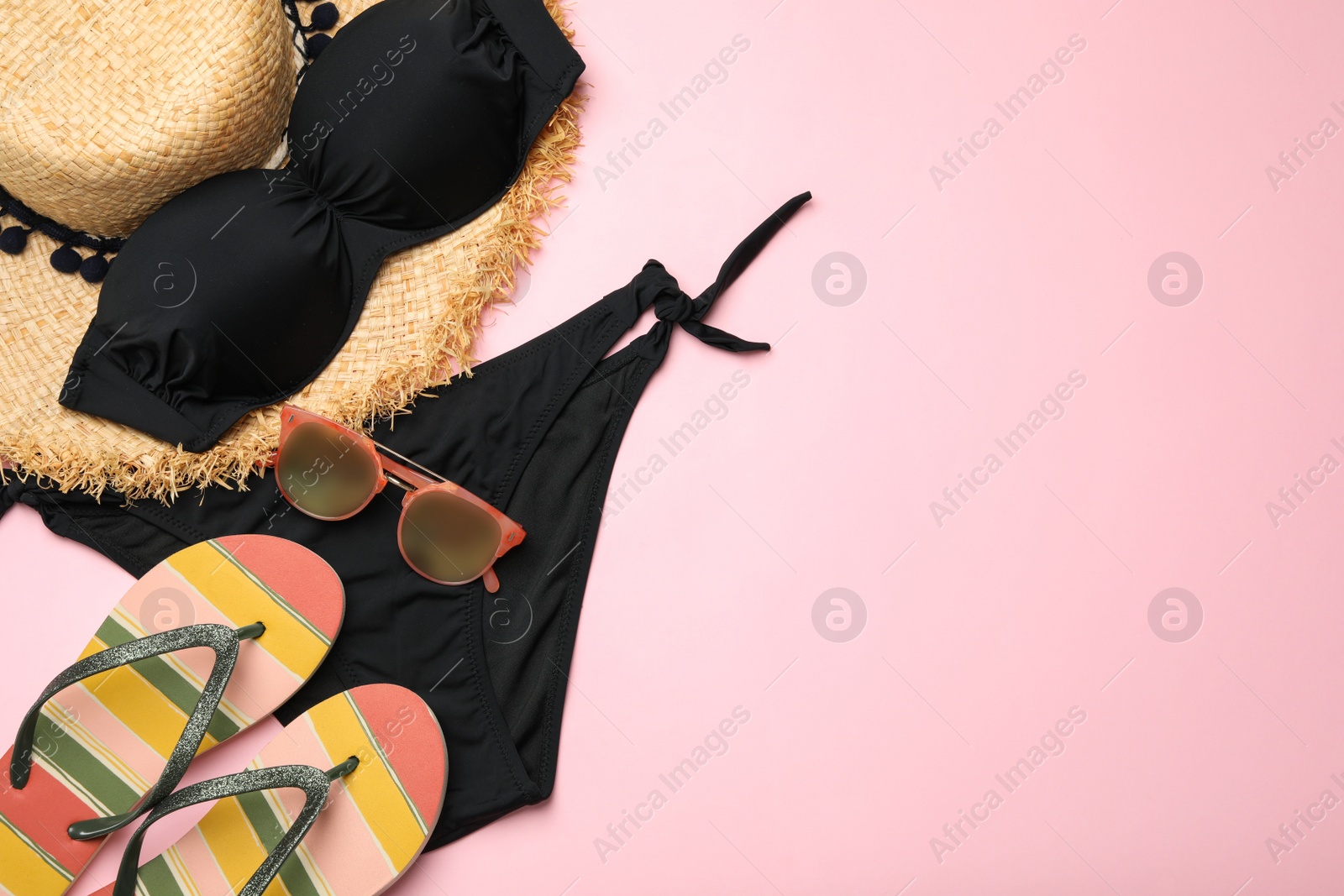 Photo of Flat lay composition with swimsuit and beach accessories on color background. Space for text