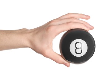 Photo of Man holding magic eight ball on white background, closeup