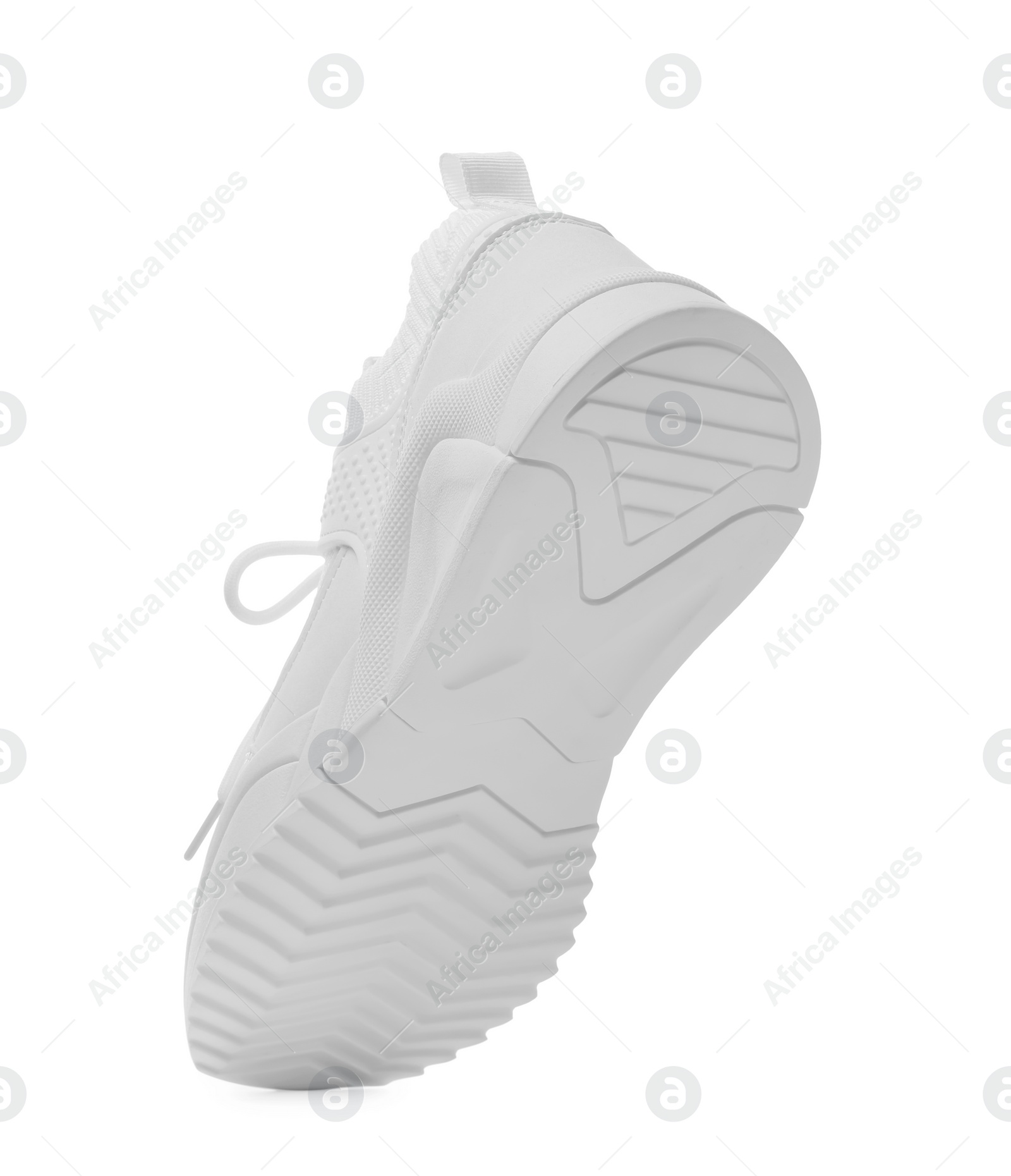 Photo of One stylish new sneaker isolated on white