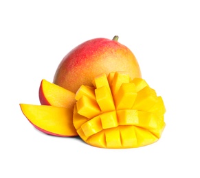 Photo of Delicious whole and cut mangoes on white background