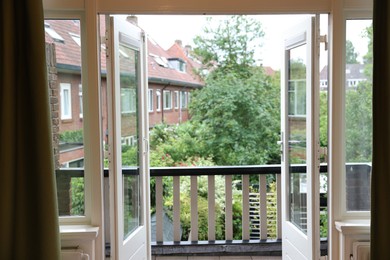 Photo of Beautiful view on balcony and inner yard with green trees from apartment