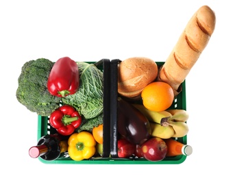 Photo of Shopping basket with grocery products on white background, top view