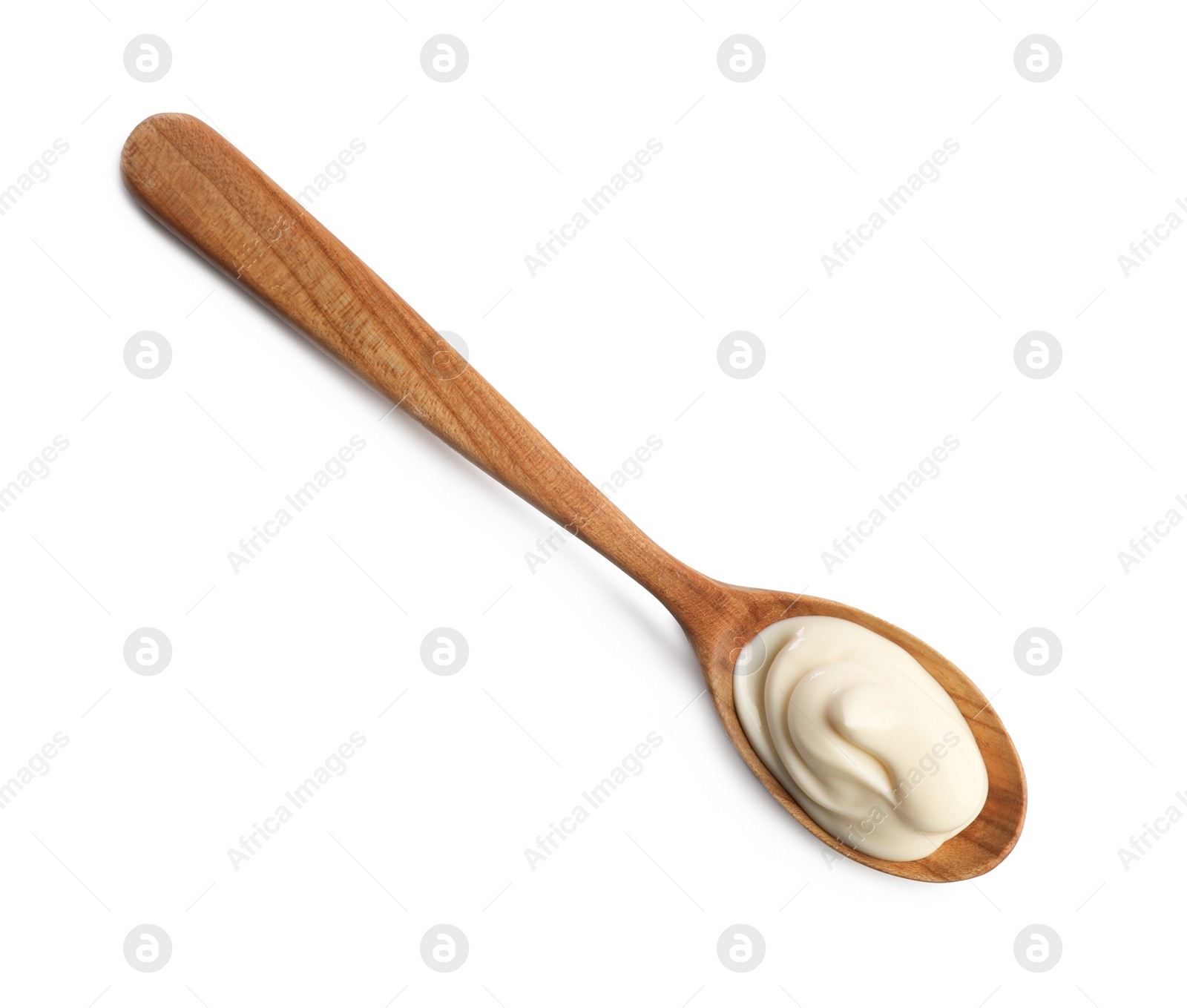 Photo of Natural yogurt in wooden spoon isolated on white, top view