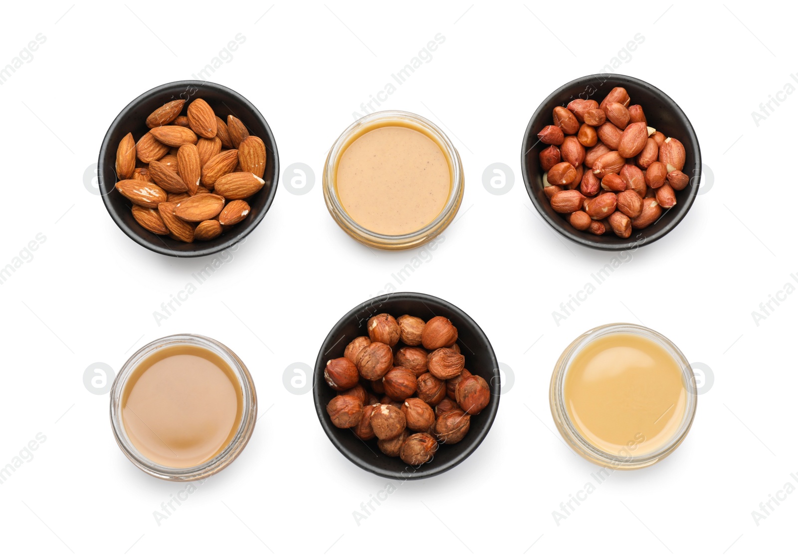 Photo of Different types of delicious nut butters and ingredients on white background, top view