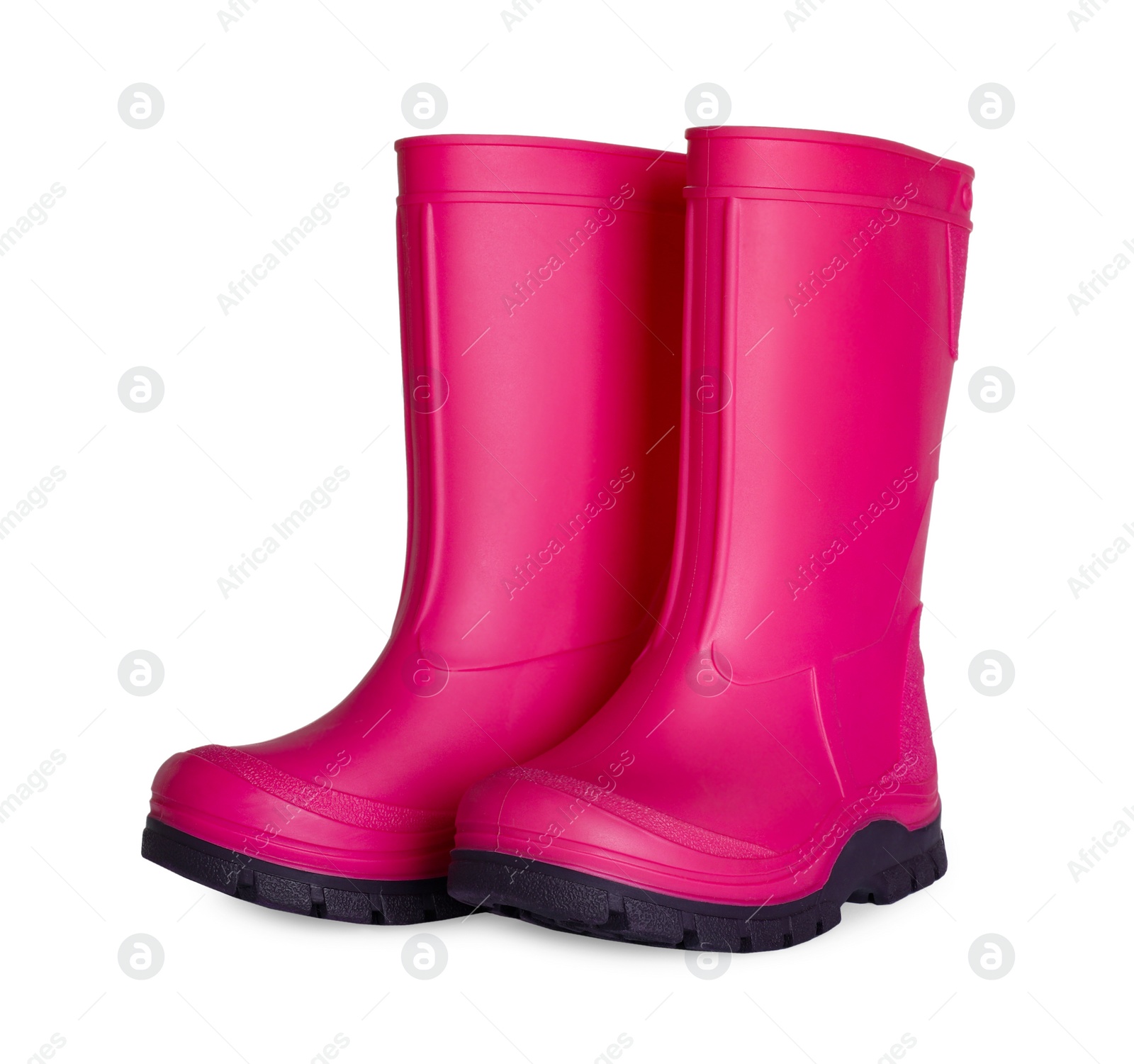 Photo of Modern pink rubber boots isolated on white