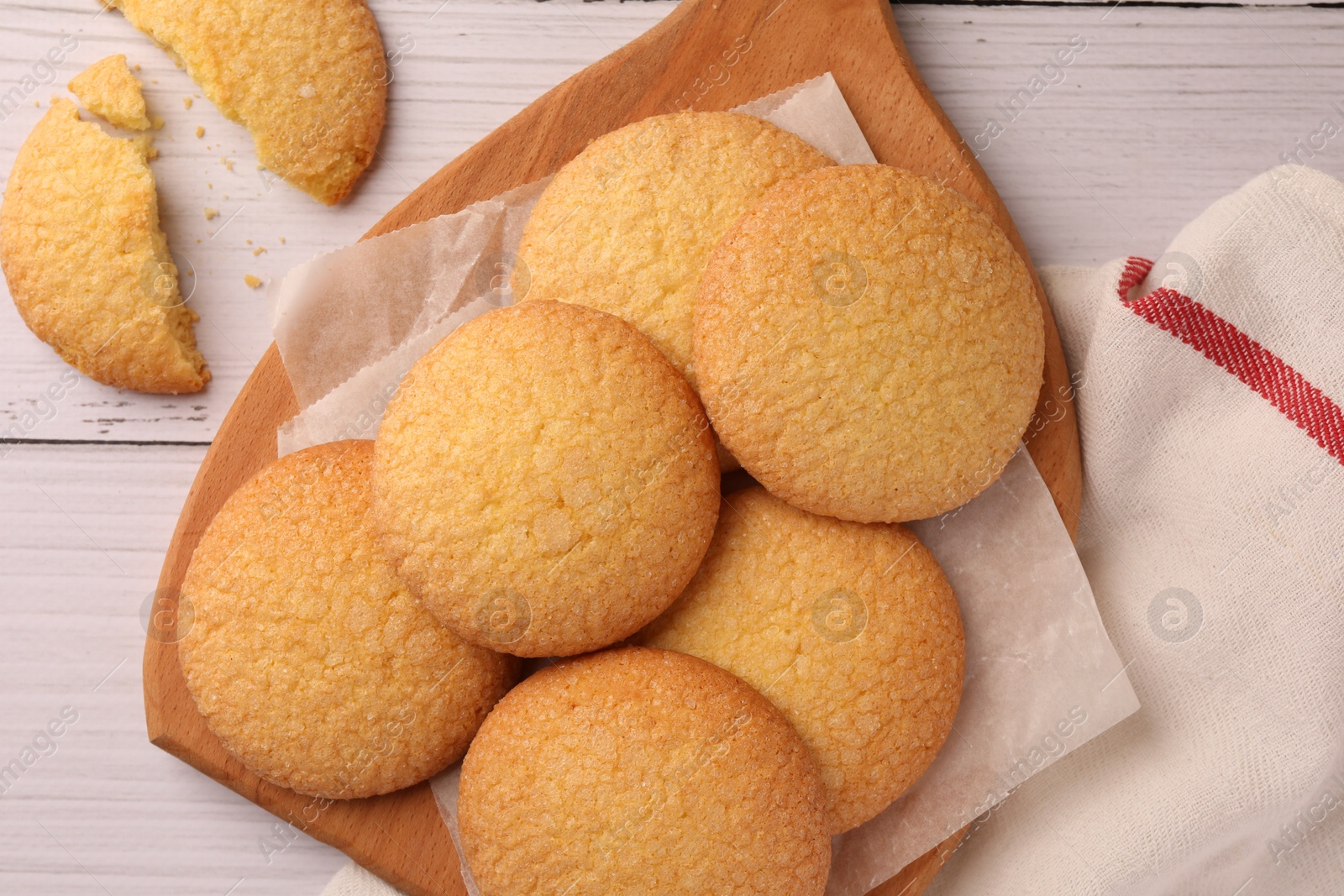 Photo of Delicious Danish butter cookies on white wooden table, flat lay