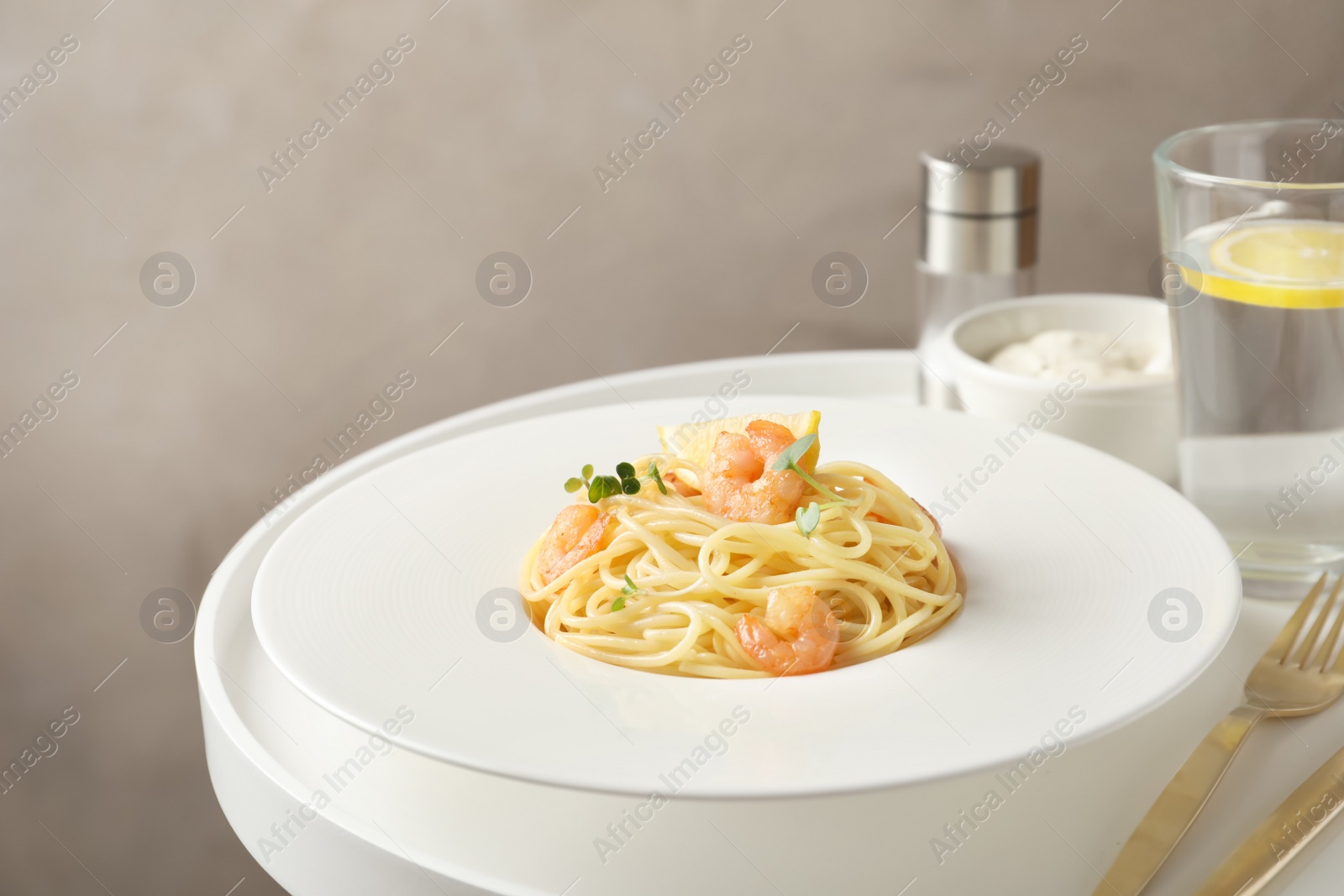 Photo of Delicious pasta with shrimps on plate