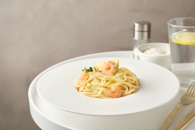 Photo of Delicious pasta with shrimps on plate