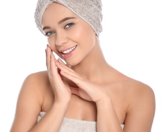 Portrait of young pretty woman with towels on white background