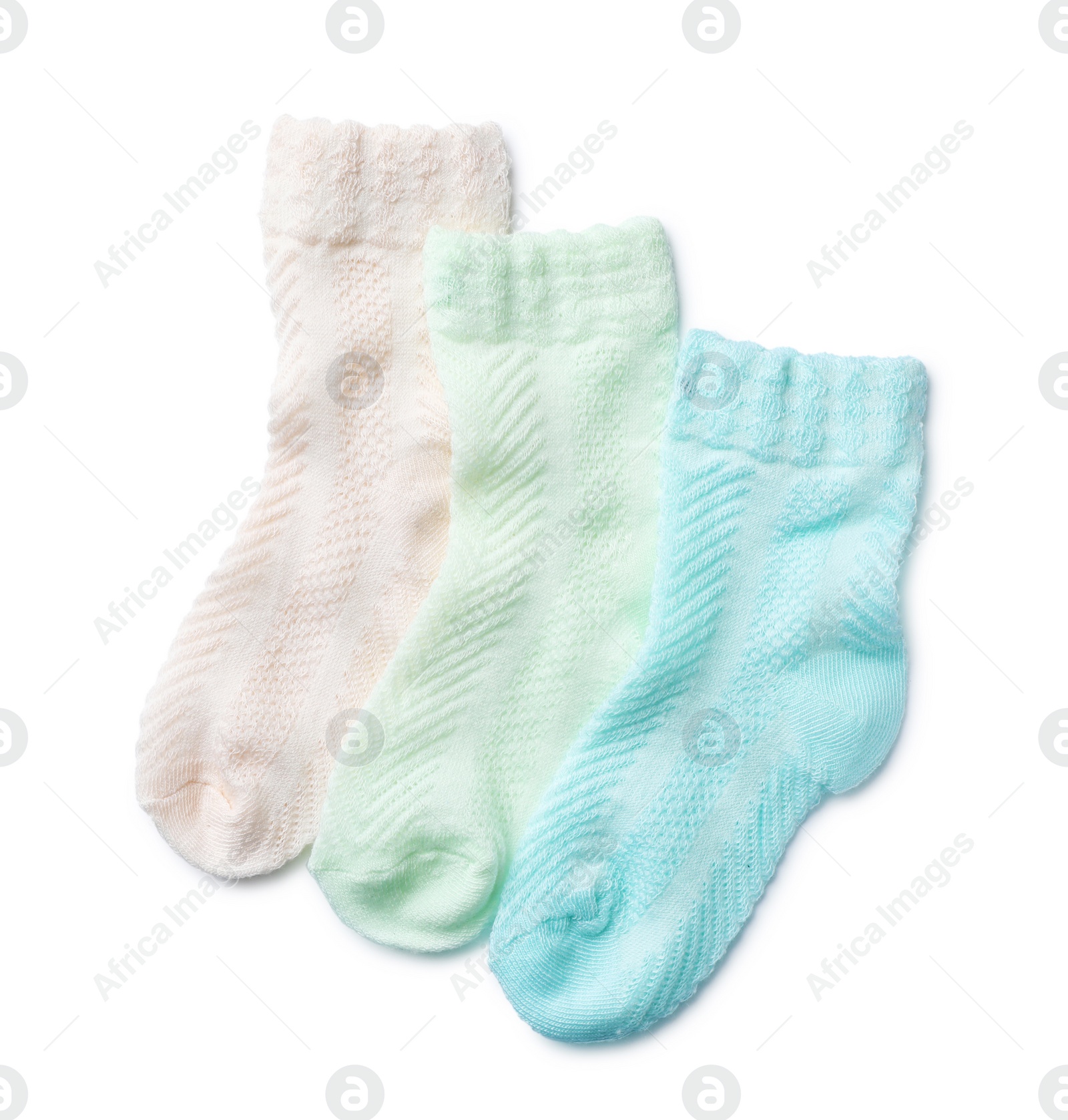 Photo of Cute child socks on white background, top view