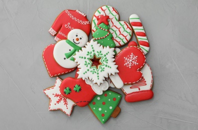 Photo of Pile of Christmas gingerbread cookies on grey background, flat lay