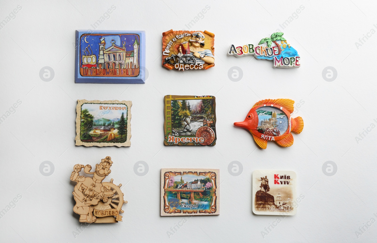 Photo of MYKOLAIV, UKRAINE - DECEMBER 24, 2018: Many different travel magnets on light background