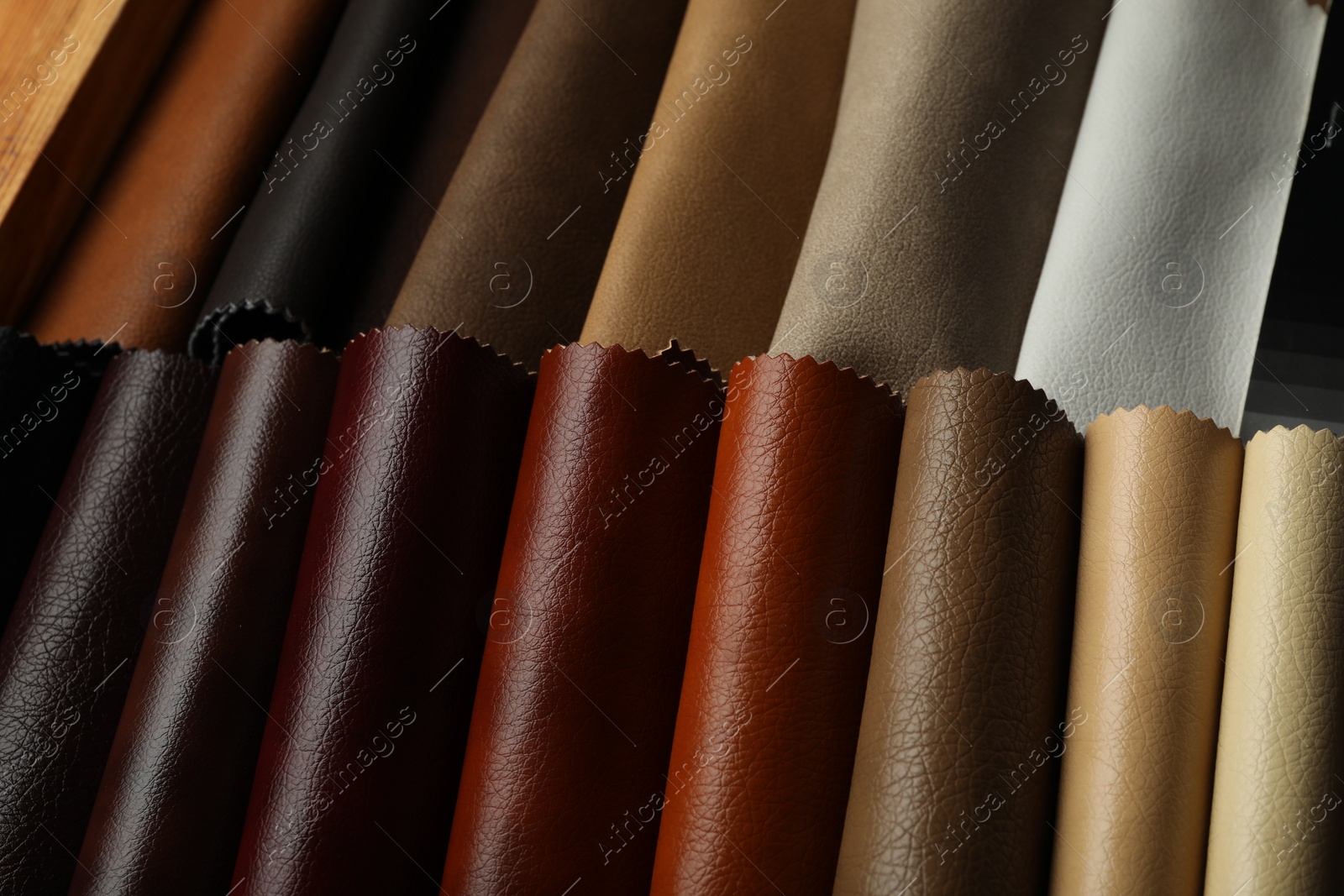 Photo of Different leather samples as background, closeup view