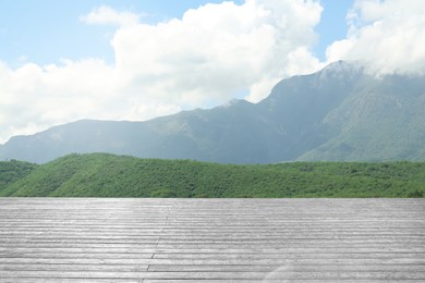 Empty wooden surface and beautiful view of mountain landscape