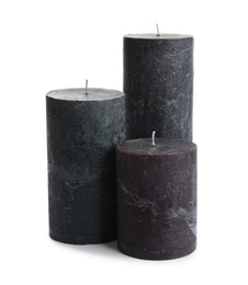 Photo of Dark aromatic decorative candles isolated on white
