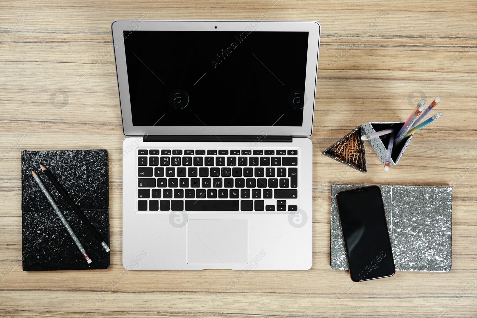 Photo of Flat lay composition with laptop on wooden table, space for text. Designer's workplace