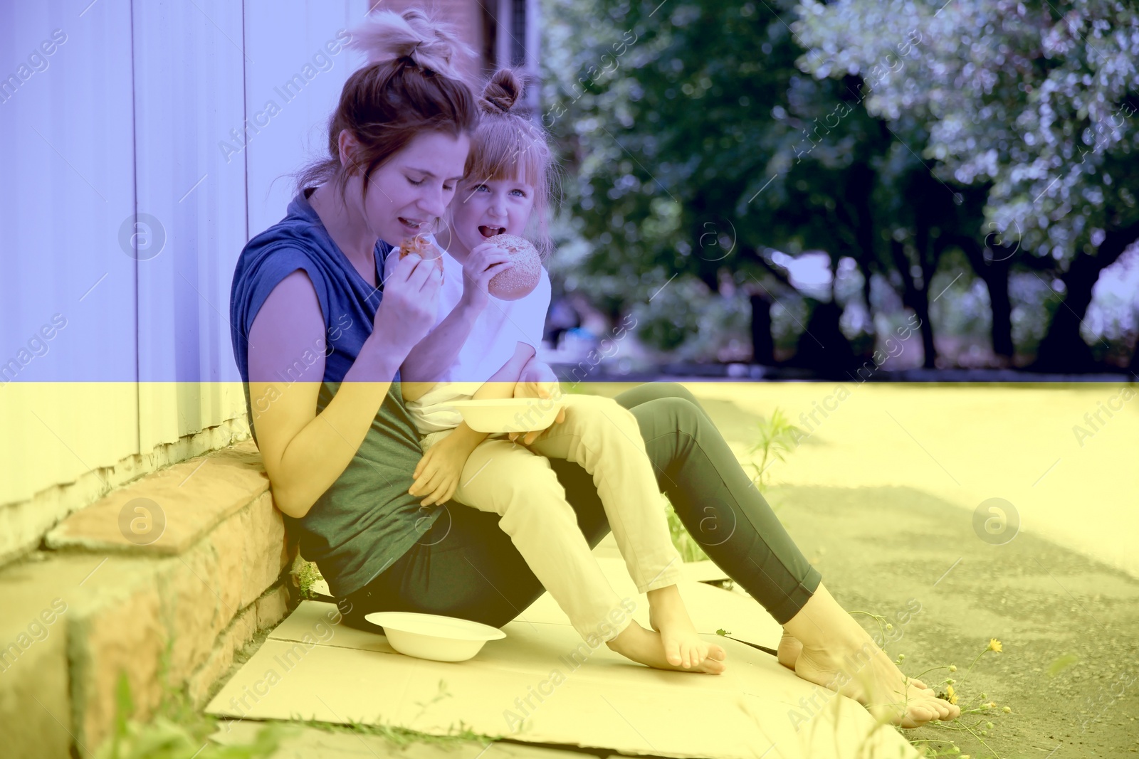 Image of Double exposure of homeless woman with little daughter eating on street and Ukrainian flag. Helping refugees during war