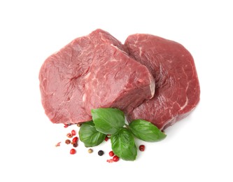 Photo of Fresh beef meat, basil leaves and spices isolated on white, top view