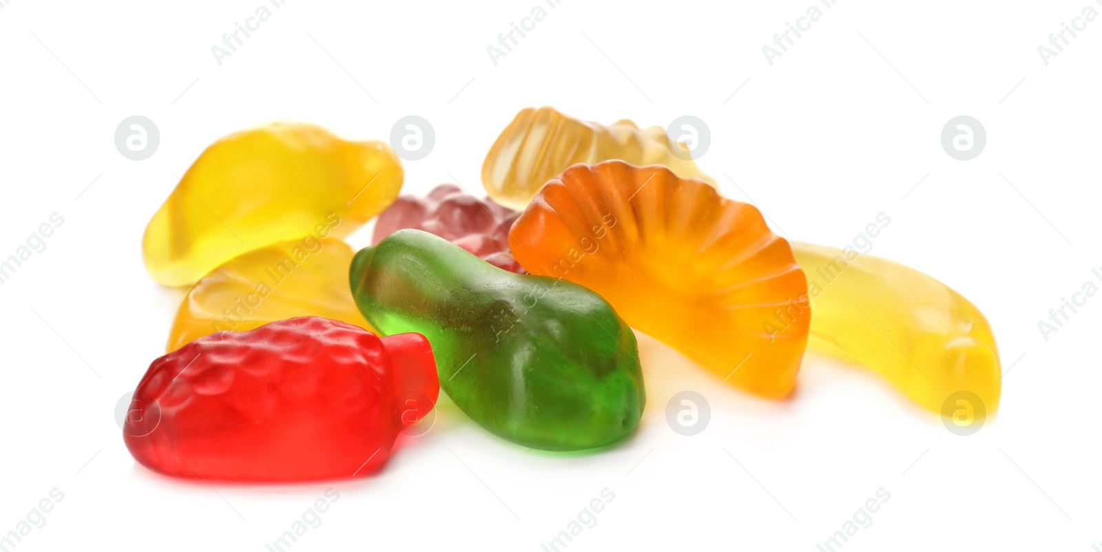 Photo of Pile with jelly fruit shaped candies on white background