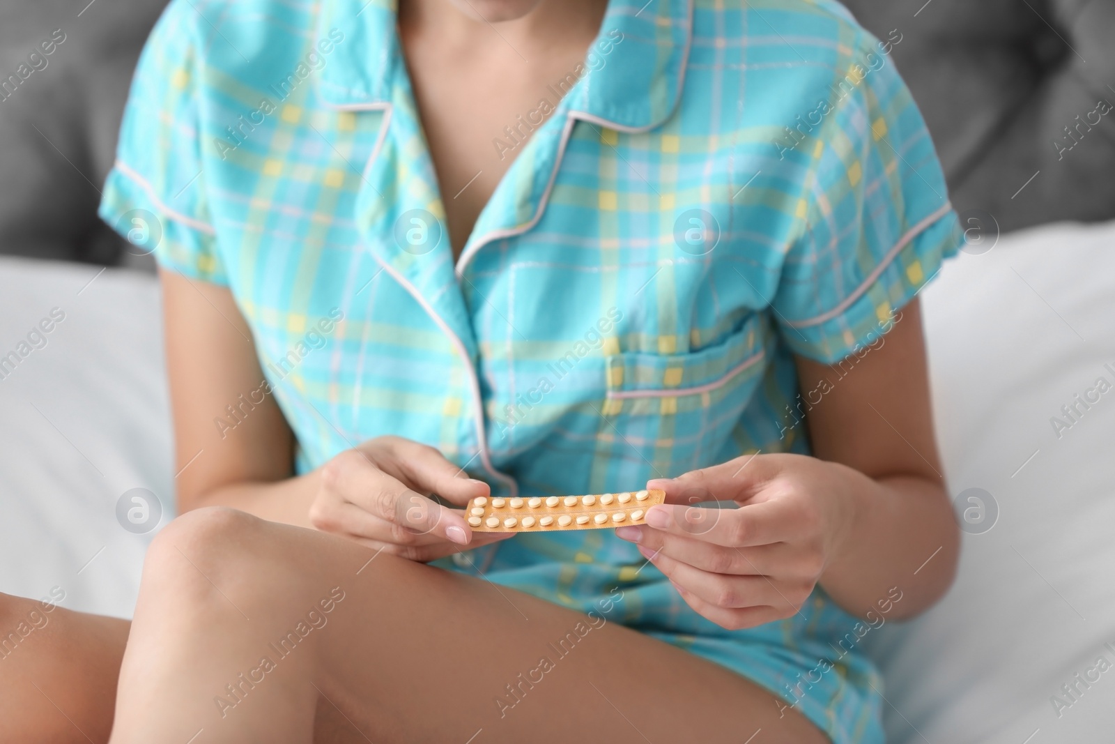 Photo of Young woman with birth control pills, closeup. Gynecology