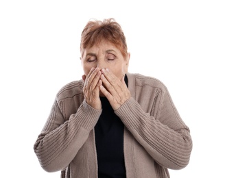 Elderly woman suffering from cough on white background