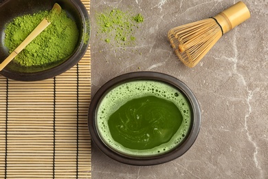 Flat lay composition with matcha tea on table