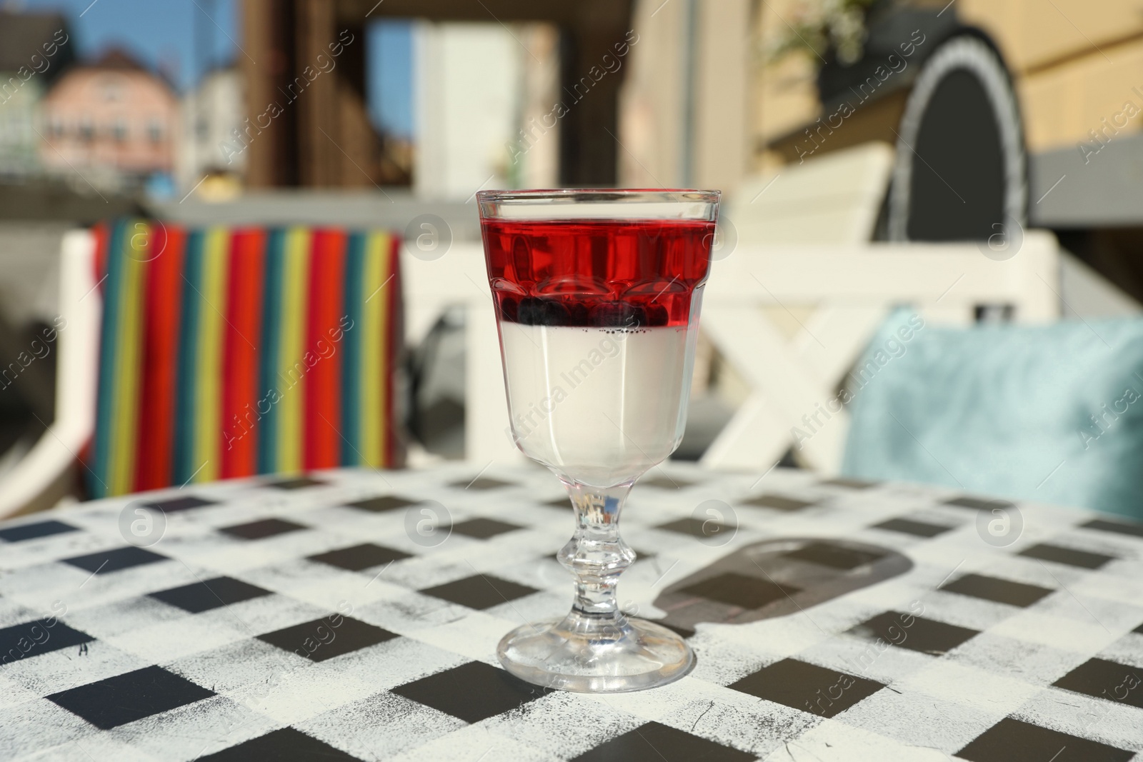 Photo of Delicious panna cotta dessert on table in cafe