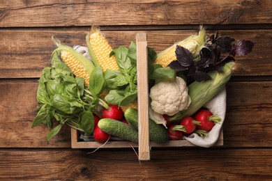 Photo of Many different vegetables on wooden table, top view