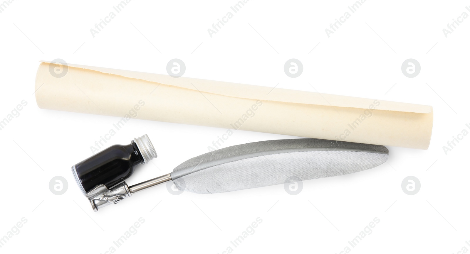 Photo of Feather pen, bottle of ink and parchment scroll on white background, top view