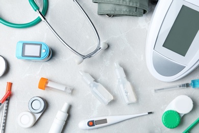 Flat lay composition with medical objects on grey background